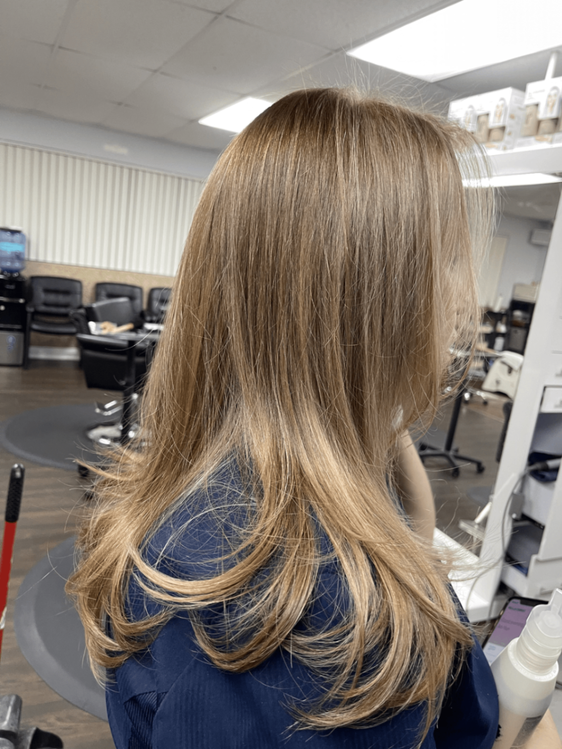 Layered blonde hairstyle with volume and shine